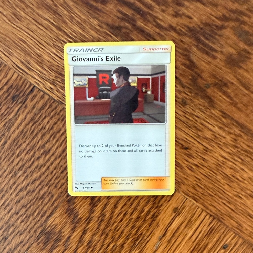 Giovanni's Exile Pokémon Trainer Supporter Card - Yellow Border